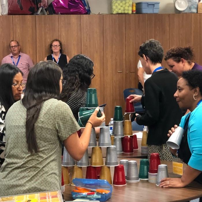 educators stacking cups